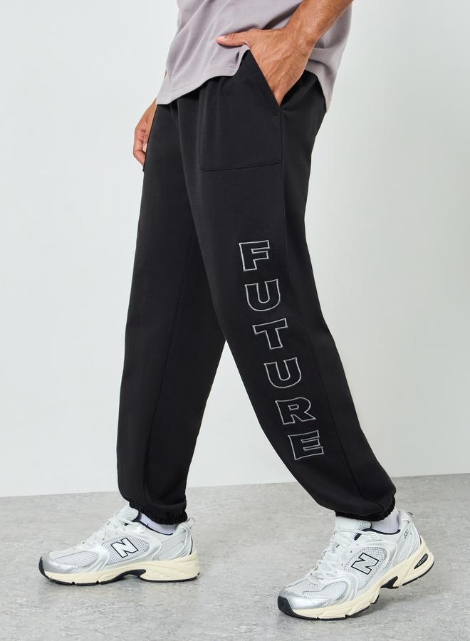 Styli Men Relaxed Fleece Embroidered Joggers - Image 1